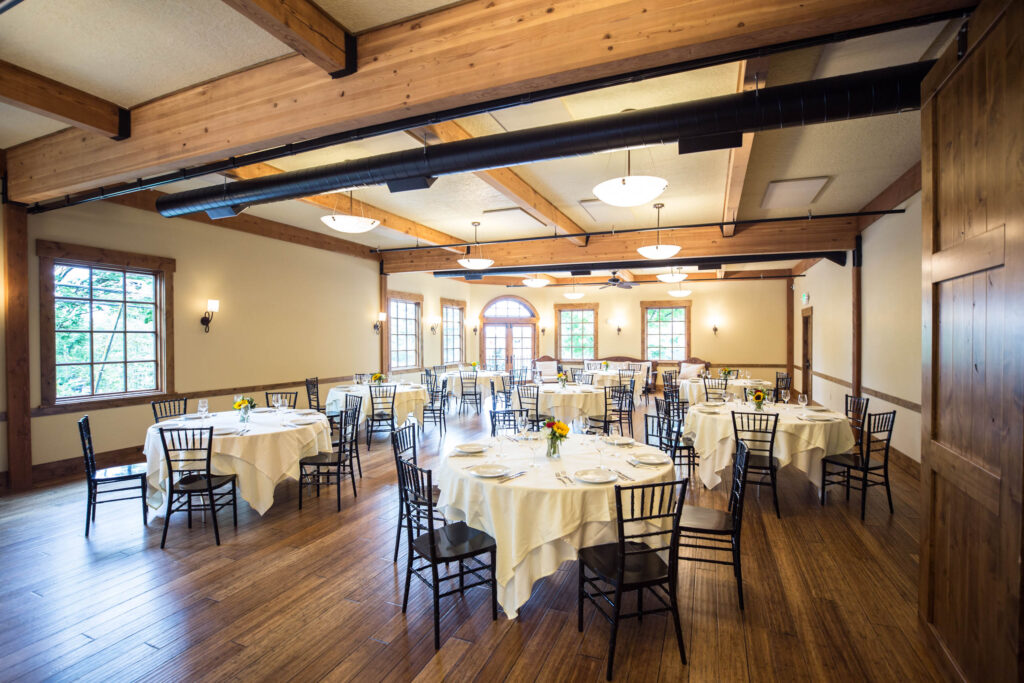 Elephants Delicatessen Corbett Room event space set up with tables, chairs, and place settings