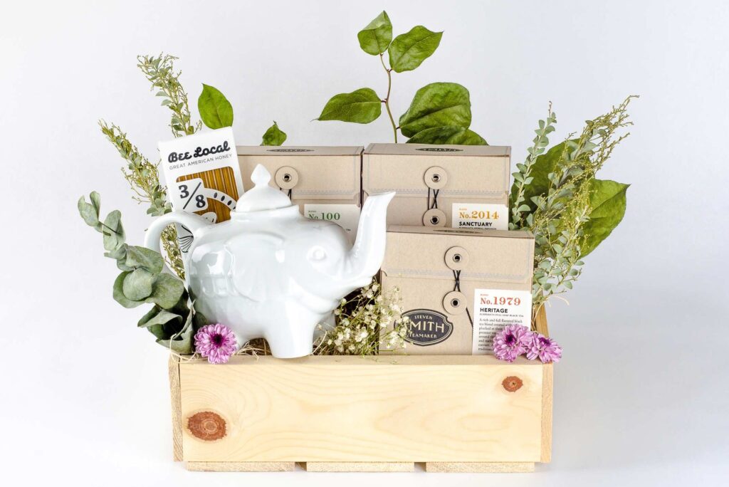 Elephants Delicatessen Tea Lovers Box with tea, honey sticks, and elephant tea pot