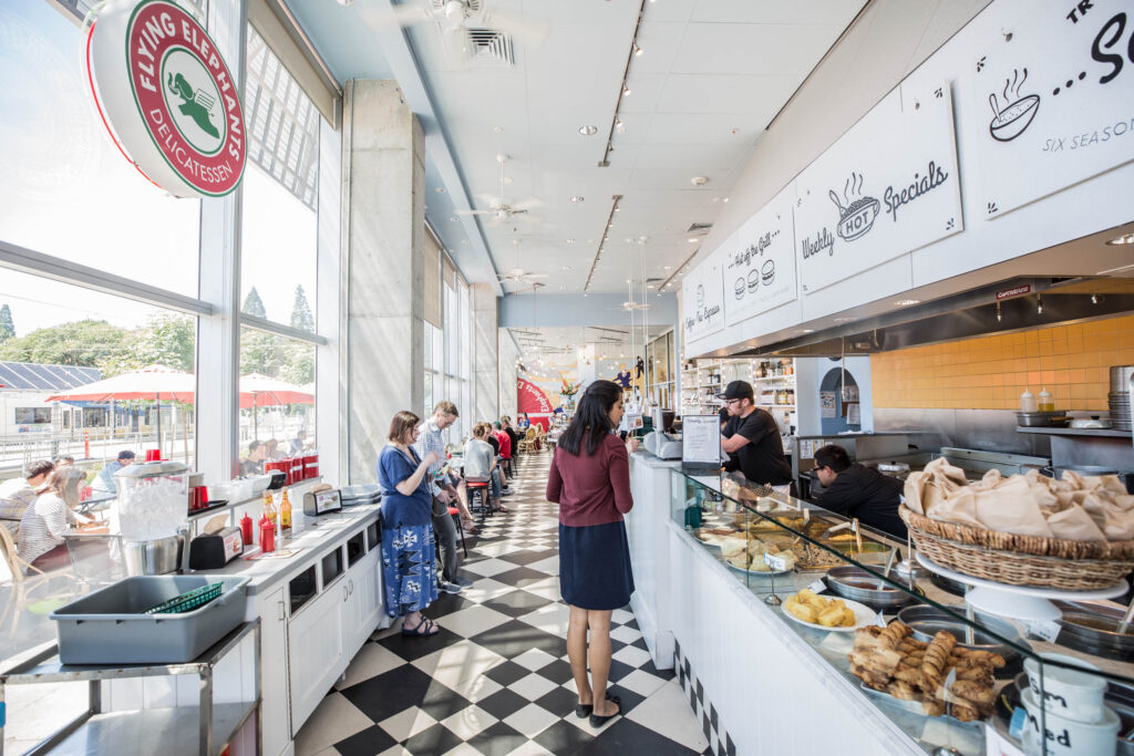 customers ordering at counter at Elephants Delicatessen South Waterfront