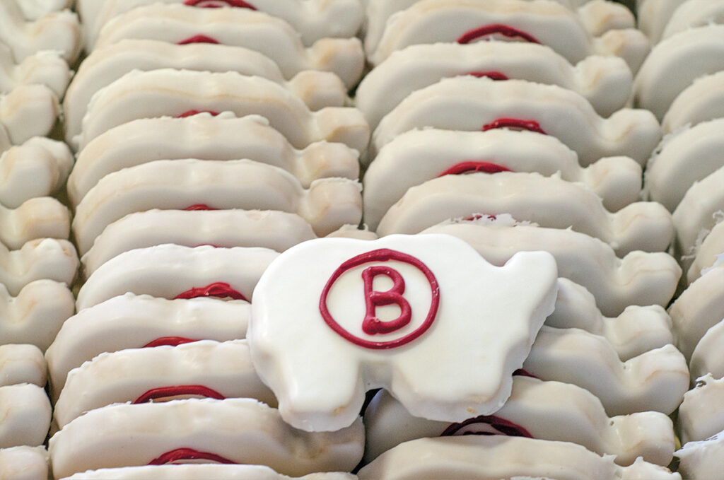 white frosted shortbread with a red b for corp
