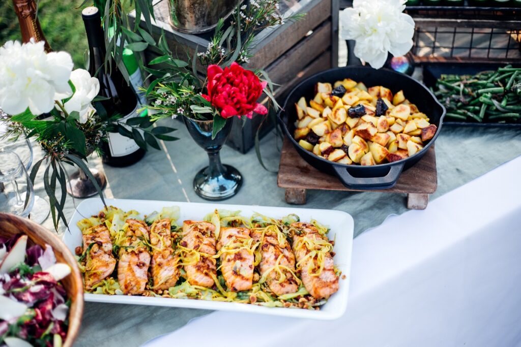Various "Oregon wine country package" food items sitting on a table in a vineyard