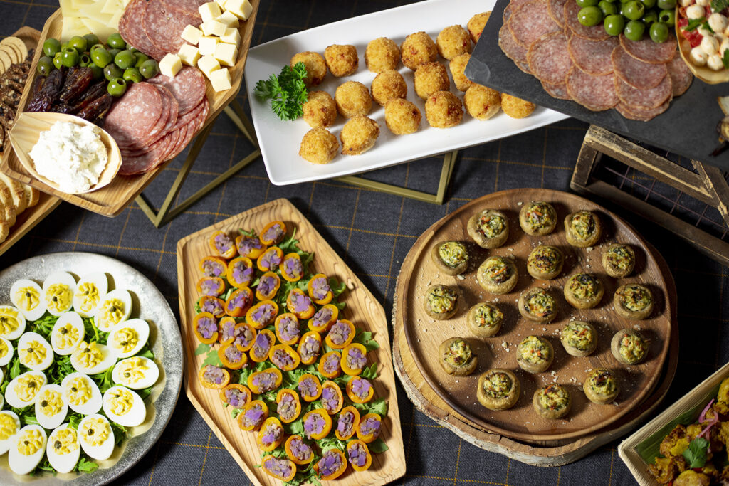 Table spread of various Elephants catering trays and appetizers