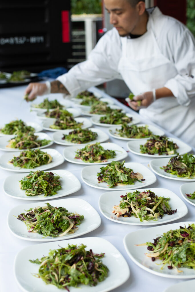 table full of salad plates with salad